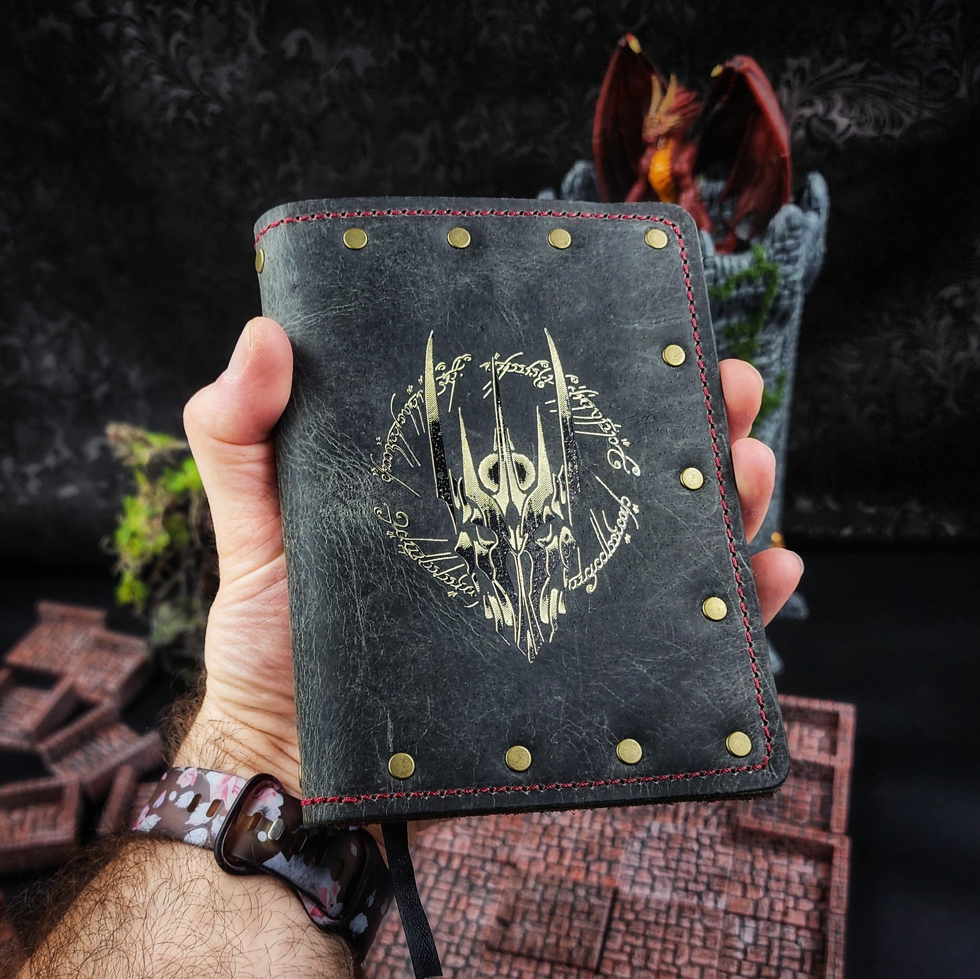 Handcrafted leather pocket adventure journals with A6 bulleted notebook inserts for D&D campaigns and FLGS retail store displays.
